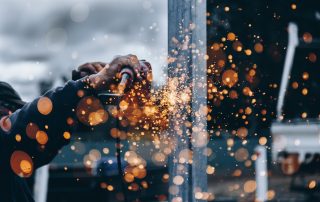 Construction Worker with welding sparks