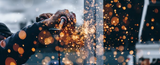 Construction Worker with welding sparks